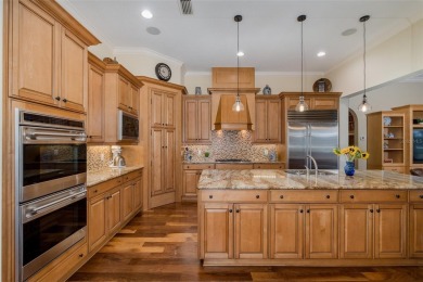 CHAMPIONS CLUB Luxury Bayfair Custom built home tucked behind on Fox Hollow Golf Club in Florida - for sale on GolfHomes.com, golf home, golf lot