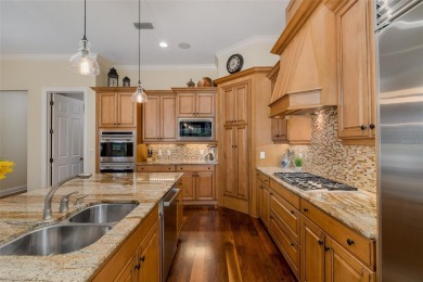 CHAMPIONS CLUB Luxury Bayfair Custom built home tucked behind on Fox Hollow Golf Club in Florida - for sale on GolfHomes.com, golf home, golf lot