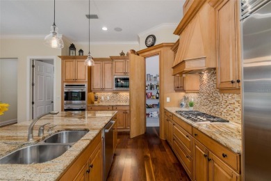 CHAMPIONS CLUB Luxury Bayfair Custom built home tucked behind on Fox Hollow Golf Club in Florida - for sale on GolfHomes.com, golf home, golf lot