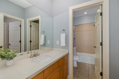 CHAMPIONS CLUB Luxury Bayfair Custom built home tucked behind on Fox Hollow Golf Club in Florida - for sale on GolfHomes.com, golf home, golf lot