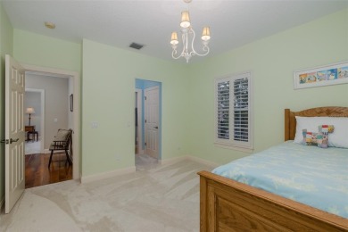 CHAMPIONS CLUB Luxury Bayfair Custom built home tucked behind on Fox Hollow Golf Club in Florida - for sale on GolfHomes.com, golf home, golf lot