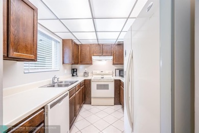 Spacious 2 bedroom, 2 bath condo well located in Deer Creek on Deer Creek Golf Club in Florida - for sale on GolfHomes.com, golf home, golf lot