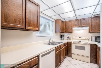 Spacious 2 bedroom, 2 bath condo well located in Deer Creek on Deer Creek Golf Club in Florida - for sale on GolfHomes.com, golf home, golf lot