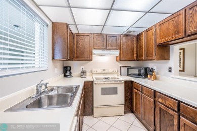Spacious 2 bedroom, 2 bath condo well located in Deer Creek on Deer Creek Golf Club in Florida - for sale on GolfHomes.com, golf home, golf lot