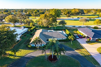 WOW! Perfectly sited on a premier .34-acre lot overlooking one on Atlantis Golf Club in Florida - for sale on GolfHomes.com, golf home, golf lot