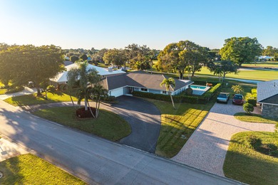 WOW! Perfectly sited on a premier .34-acre lot overlooking one on Atlantis Golf Club in Florida - for sale on GolfHomes.com, golf home, golf lot