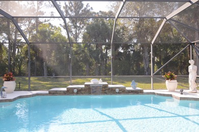 Stunning 3 bedroom, 3.5 pool home situated on an estate lot on Meadowood Golf and Tennis Club in Florida - for sale on GolfHomes.com, golf home, golf lot