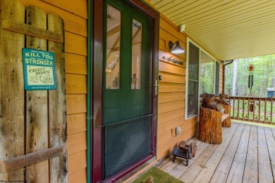 Welcome to 'Evening Shade', a charming, furnished cabin nestled on Alpine Lake Resort in West Virginia - for sale on GolfHomes.com, golf home, golf lot