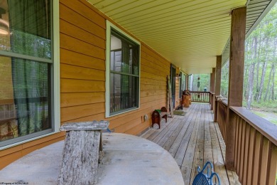 Welcome to 'Evening Shade', a charming, furnished cabin nestled on Alpine Lake Resort in West Virginia - for sale on GolfHomes.com, golf home, golf lot