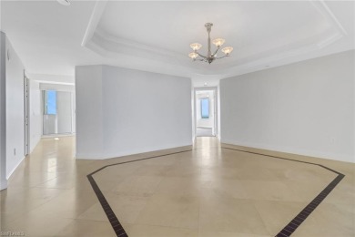 Imagine waking up to the vibrant hues of sunrise painting the on Club at Pelican Bay Golf Course in Florida - for sale on GolfHomes.com, golf home, golf lot