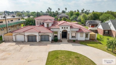 This beautiful 4-bedroom, 3.5-bath home with a finished 3-car on South Padre Island Golf Club in Texas - for sale on GolfHomes.com, golf home, golf lot