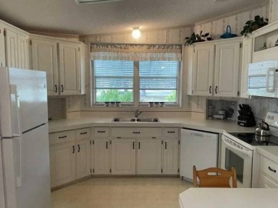 TIRED OF SNOW,ICE AND COLD, TRADE THAT IN FOR SUN,WARM AND WHITE on Pine Lakes Country Club in Florida - for sale on GolfHomes.com, golf home, golf lot