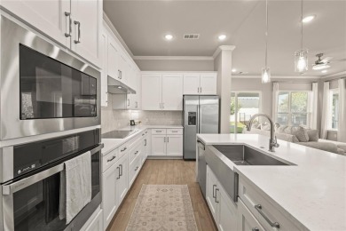 Welcome to a home that blends designer style with everyday on Wildhorse Golf Club of Robson Ranch in Texas - for sale on GolfHomes.com, golf home, golf lot