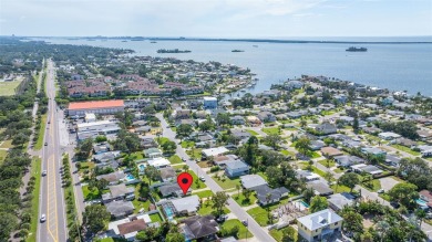 Welcome to this beautifully updated single-family pool home in on The Dunedin Country Club in Florida - for sale on GolfHomes.com, golf home, golf lot