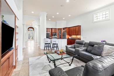 This former model home in Mizner Country Club has IMMEDIATE GOLF on Mizner Country Club in Florida - for sale on GolfHomes.com, golf home, golf lot