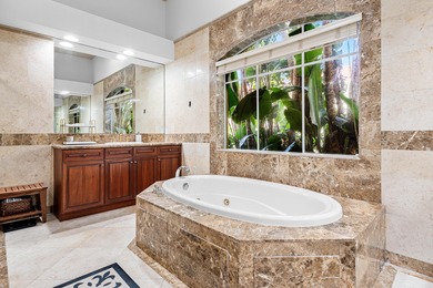 This former model home in Mizner Country Club has IMMEDIATE GOLF on Mizner Country Club in Florida - for sale on GolfHomes.com, golf home, golf lot