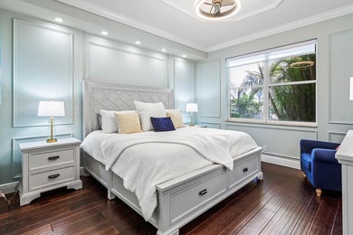 This former model home in Mizner Country Club has IMMEDIATE GOLF on Mizner Country Club in Florida - for sale on GolfHomes.com, golf home, golf lot