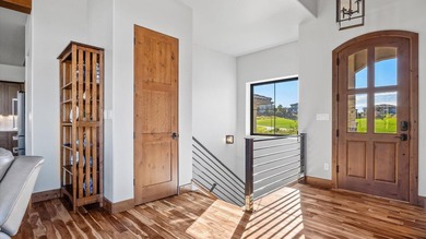 Golf course views - Resort-style pool & outdoor kitchen - on The Golf Club At Redlands Mesa in Colorado - for sale on GolfHomes.com, golf home, golf lot