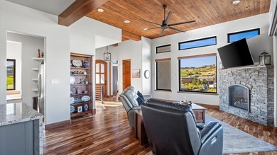 Golf course views - Resort-style pool & outdoor kitchen - on The Golf Club At Redlands Mesa in Colorado - for sale on GolfHomes.com, golf home, golf lot