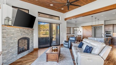 Golf course views - Resort-style pool & outdoor kitchen - on The Golf Club At Redlands Mesa in Colorado - for sale on GolfHomes.com, golf home, golf lot