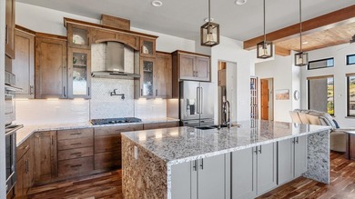 Golf course views - Resort-style pool & outdoor kitchen - on The Golf Club At Redlands Mesa in Colorado - for sale on GolfHomes.com, golf home, golf lot