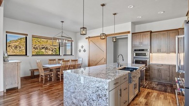 Golf course views - Resort-style pool & outdoor kitchen - on The Golf Club At Redlands Mesa in Colorado - for sale on GolfHomes.com, golf home, golf lot