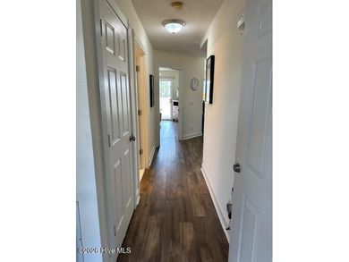 Spacious, fully furnished 2BR/2BA second-floor center-unit condo on Brunswick Plantation and Golf Resorts in North Carolina - for sale on GolfHomes.com, golf home, golf lot