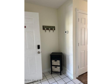 Spacious, fully furnished 2BR/2BA second-floor center-unit condo on Brunswick Plantation and Golf Resorts in North Carolina - for sale on GolfHomes.com, golf home, golf lot