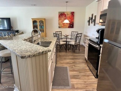 Spacious, fully furnished 2BR/2BA second-floor center-unit condo on Brunswick Plantation and Golf Resorts in North Carolina - for sale on GolfHomes.com, golf home, golf lot