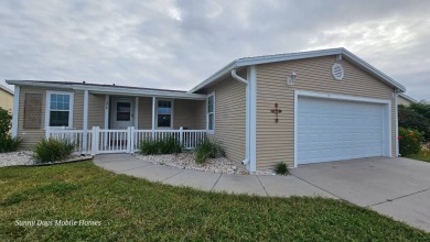 Come take a tour of this 2016 Palm Harbor Wellington Model one on The Riverside Golf Club in Florida - for sale on GolfHomes.com, golf home, golf lot