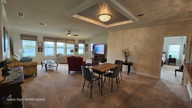 Come take a tour of this 2016 Palm Harbor Wellington Model one on The Riverside Golf Club in Florida - for sale on GolfHomes.com, golf home, golf lot