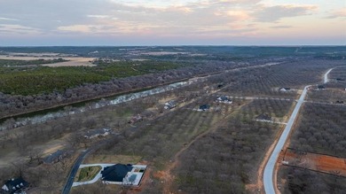 Treed 1.5 acre lot in The Landings East at Pecan Plantation on Pecan Plantation Country Club in Texas - for sale on GolfHomes.com, golf home, golf lot