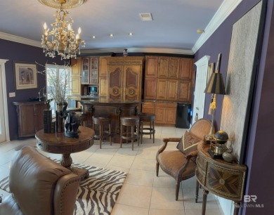 Ever dream of living on Marina Road? This single-story home on Orange Beach Golf Center in Alabama - for sale on GolfHomes.com, golf home, golf lot