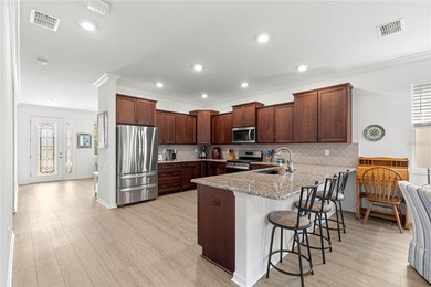 This upgraded Orchid model is located in the desirable Weybourne on Candler Hills Golf and Country Club in Florida - for sale on GolfHomes.com, golf home, golf lot