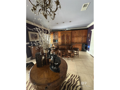 Ever dream of living on Marina Road? This single-story home on Orange Beach Golf Center in Alabama - for sale on GolfHomes.com, golf home, golf lot