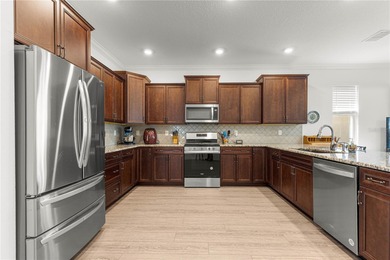 This upgraded Orchid model is located in the desirable Weybourne on Candler Hills Golf and Country Club in Florida - for sale on GolfHomes.com, golf home, golf lot