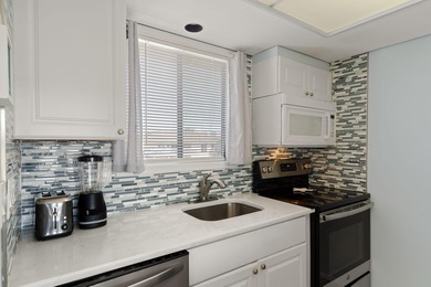 Experience resort-style living in this beautifully updated on Sandpiper Cove Golf Course in Florida - for sale on GolfHomes.com, golf home, golf lot