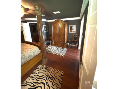 Ever dream of living on Marina Road? This single-story home on Orange Beach Golf Center in Alabama - for sale on GolfHomes.com, golf home, golf lot