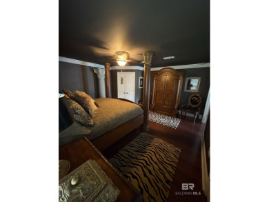 Ever dream of living on Marina Road? This single-story home on Orange Beach Golf Center in Alabama - for sale on GolfHomes.com, golf home, golf lot