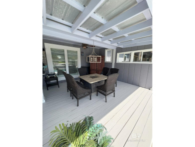Ever dream of living on Marina Road? This single-story home on Orange Beach Golf Center in Alabama - for sale on GolfHomes.com, golf home, golf lot