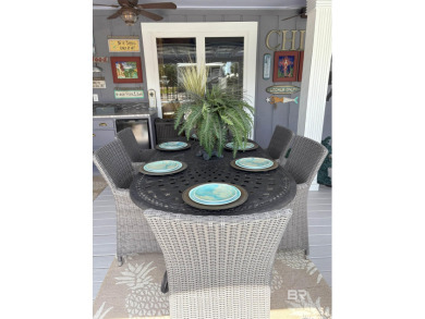 Ever dream of living on Marina Road? This single-story home on Orange Beach Golf Center in Alabama - for sale on GolfHomes.com, golf home, golf lot