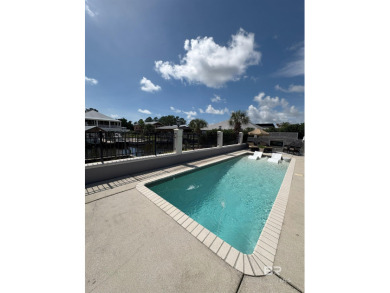 Ever dream of living on Marina Road? This single-story home on Orange Beach Golf Center in Alabama - for sale on GolfHomes.com, golf home, golf lot
