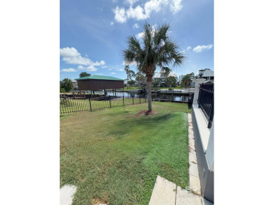 Ever dream of living on Marina Road? This single-story home on Orange Beach Golf Center in Alabama - for sale on GolfHomes.com, golf home, golf lot