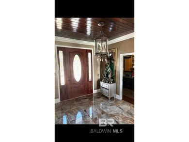 Single-story Boat Slip & Pool Home Turn Key Furnished. Unlike on Orange Beach Golf Center in Alabama - for sale on GolfHomes.com, golf home, golf lot