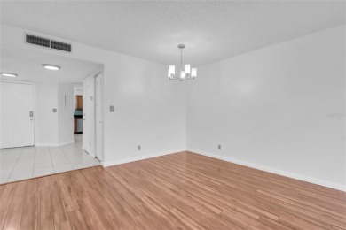Newly painted two bedroom two full bath one level condo on the on Isla Del Sol Yacht and Country Club in Florida - for sale on GolfHomes.com, golf home, golf lot