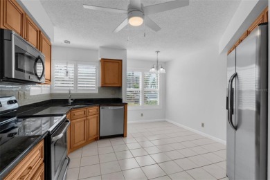 Newly painted two bedroom two full bath one level condo on the on Isla Del Sol Yacht and Country Club in Florida - for sale on GolfHomes.com, golf home, golf lot