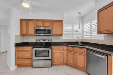 Newly painted two bedroom two full bath one level condo on the on Isla Del Sol Yacht and Country Club in Florida - for sale on GolfHomes.com, golf home, golf lot
