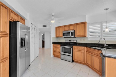 Newly painted two bedroom two full bath one level condo on the on Isla Del Sol Yacht and Country Club in Florida - for sale on GolfHomes.com, golf home, golf lot