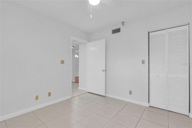 Newly painted two bedroom two full bath one level condo on the on Isla Del Sol Yacht and Country Club in Florida - for sale on GolfHomes.com, golf home, golf lot