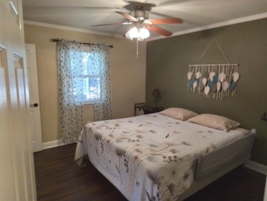 Don't miss this one! Beautifully shaded, freshly painted, well on Wildwood Country Club in Florida - for sale on GolfHomes.com, golf home, golf lot